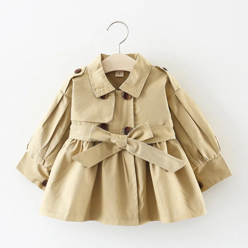 Baby girl's stylish beige trench coat with belt and buttons – perfect autumn and winter outerwear.