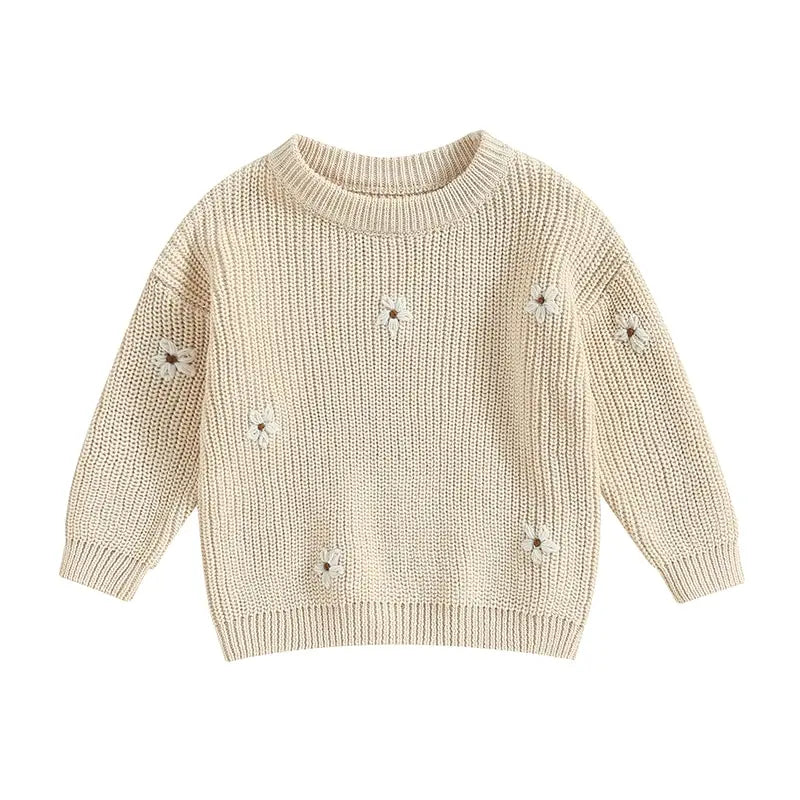 A soft knitted sweater with colourful flower print, round neck and full sleeves.