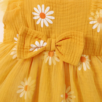 Cute summer dress for baby girls with cheerful daisy pattern featuring its bow