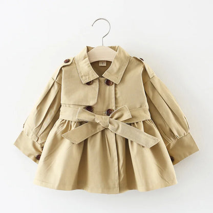 Baby girl's stylish beige trench coat with belt and buttons – perfect autumn and winter outerwear.