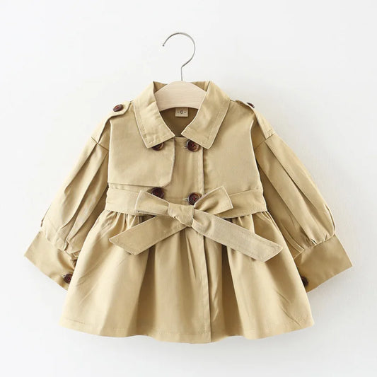 Baby girl's stylish beige trench coat with belt and buttons – perfect autumn and winter outerwear.