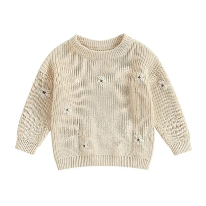 A soft knitted sweater with colourful flower print, round neck and full sleeves.