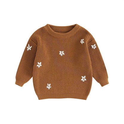 A soft knitted sweater with colourful flower print, round neck and full sleeves.