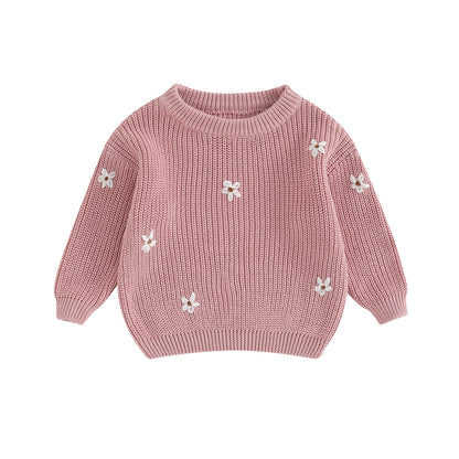 A soft knitted sweater with colourful flower print, round neck and full sleeves.