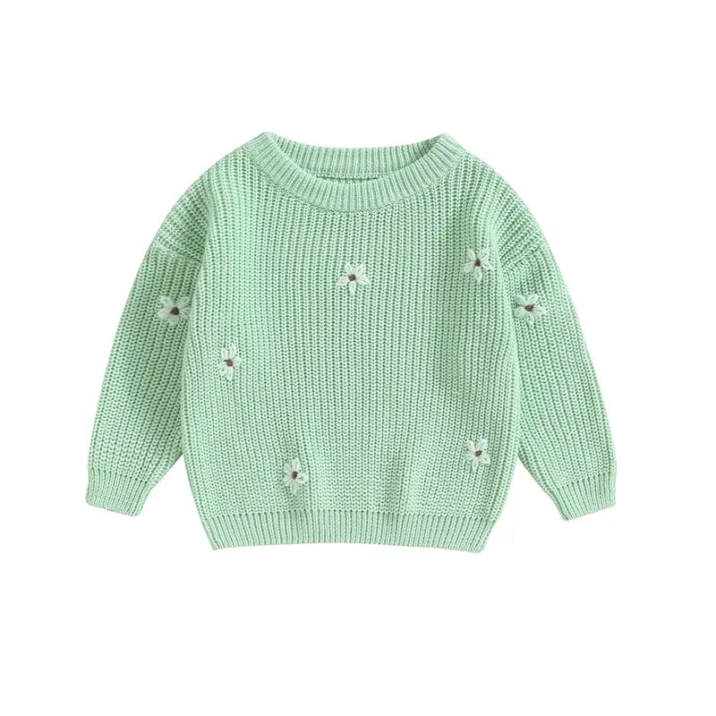 A soft knitted sweater with colourful flower print, round neck and full sleeves.