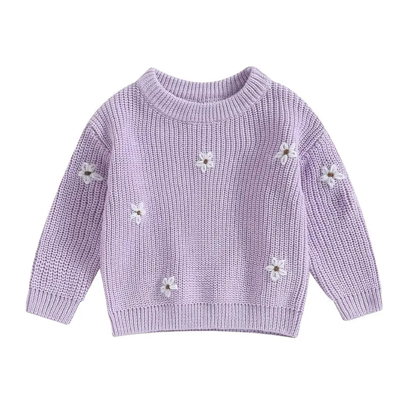A soft knitted sweater with colourful flower print, round neck and full sleeves.