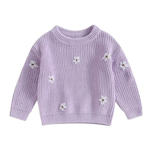 A soft knitted sweater with colourful flower print, round neck and full sleeves.