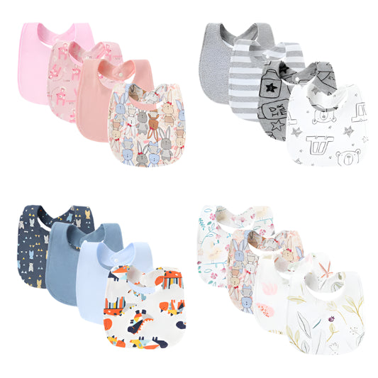 A collection of baby bibs in various designs and colors, displayed in two rows. The bibs appear to be made of a soft fabric and have snap closures.