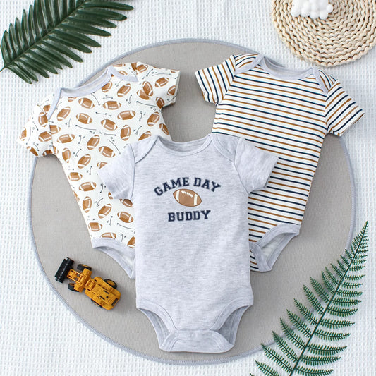 Set of three game day baby bodysuits with playful sports-themed prints